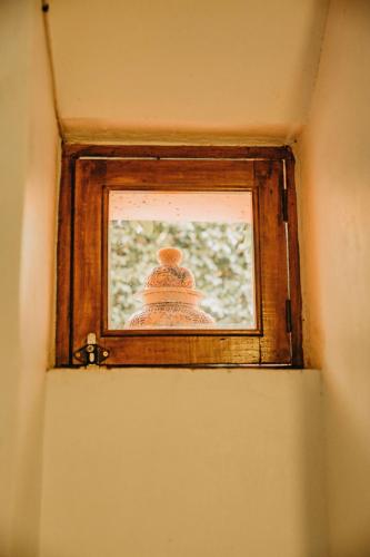 a small window in the corner of a room at Hotel Casa Pereyra in Oaxaca City