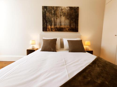 Ένα ή περισσότερα κρεβάτια σε δωμάτιο στο Porto Retreat Pool&Garden