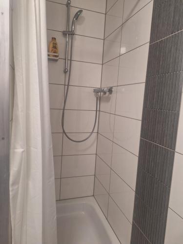 a bathroom with a shower with a shower curtain at Studio Apartment 14 - 2L2 in Essen