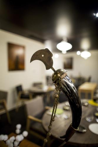 a wooden table with an umbrella on top of it at Aux Terrasses in Tournus