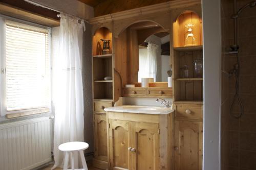 a bathroom with a sink and a mirror at Domaine de la Brette in Condom