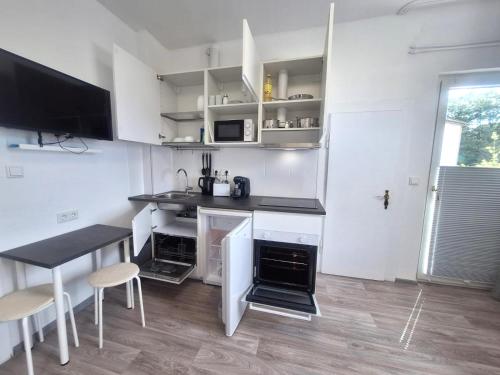 Кухня или мини-кухня в Studio Apartment mit Balkon 18
