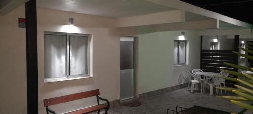 a waiting room with a bench and a staircase at Apartamento Familiar Marta in Colonia del Sacramento