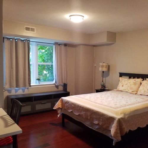 a bedroom with a bed and a window at Fairmount House Free Street Parking Quiet Spacious in Philadelphia