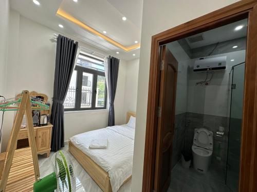 a bedroom with a bunk bed and a shower at 1994 House in Da Thanh