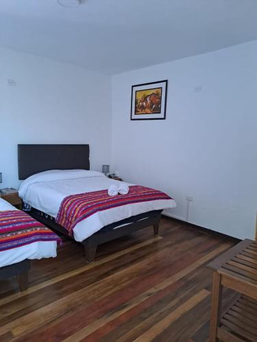 Postel nebo postele na pokoji v ubytování CASA HUAYNA HOUSE VITOQuE
