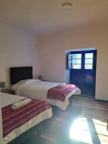 Postel nebo postele na pokoji v ubytování CASA HUAYNA HOUSE VITOQuE