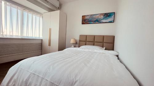 Postel nebo postele na pokoji v ubytování Beijing Jiuxian Apartment
