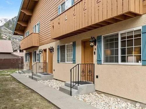 a house with steps leading up to a building at Cozy Bavarian Getaway in Leavenworth