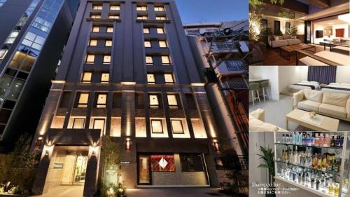 a large building with lights on in a city at Amistad Hotel Fukuoka in Fukuoka