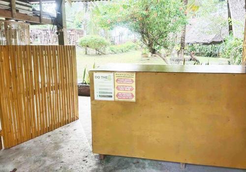 a counter in a building with a sign on it at Eco Glamping Treehouses Closest Resort To All Tourist Attractions in Balilihan