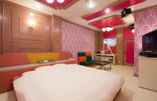 a bedroom with a large bed and a television at ホテル　アイネ　香芝店 in Kashiba
