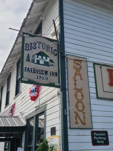 a sign for a barneway inn on the side of a building at The Fairview Inn in Talkeetna