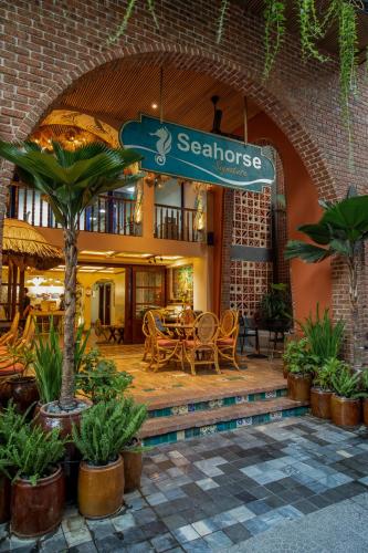 a restaurant with a sign that reads seahorses at Seahorse Signature Danang Hotel by Haviland in Da Nang