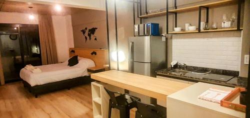 a kitchen with a refrigerator and a sink in it at Alsina Suite!! Hermoso y moderno apart en Salta!! in Salta