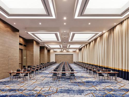 an empty conference room with tables and chairs at InterContinental Warszawa by IHG in Warsaw