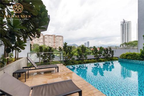 a swimming pool on the roof of a building at Neu Suites Residence KLCC, Five Senses in Kuala Lumpur