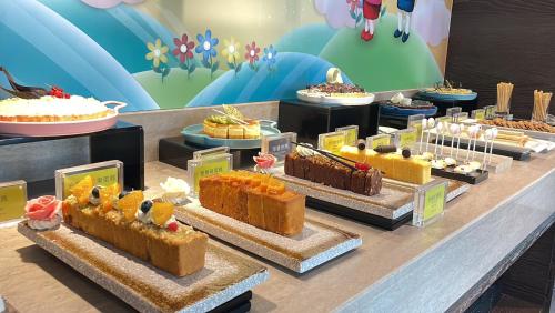 a display of different types of cakes on a table at Walden Hotel in Yilan City