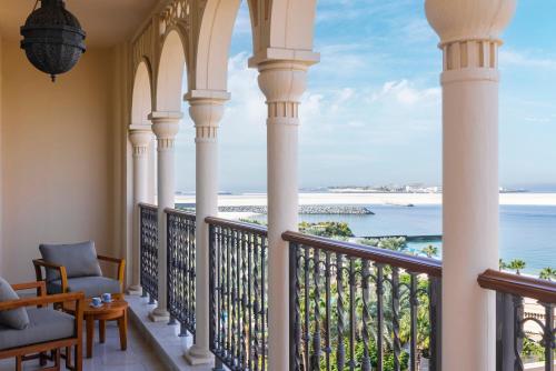a balcony with a view of the ocean at Four Seasons Resort Dubai at Jumeirah Beach in Dubai