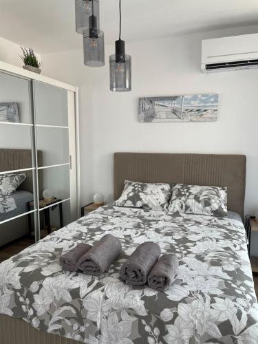 a bedroom with a bed with pillows on it at SUNNY STUDIO AZUR in Saints Constantine and Helena