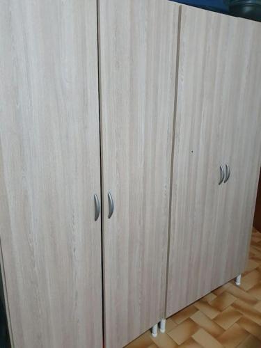 a pair of wooden cabinets with silver knobs on them at Casa T1 em Alverca. in Arsena