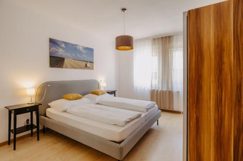 En eller flere senge i et værelse på Ferienwohnung Illy