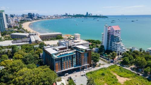 an aerial view of a city with a beach and buildings at Courtyard by Marriott North Pattaya in Pattaya North