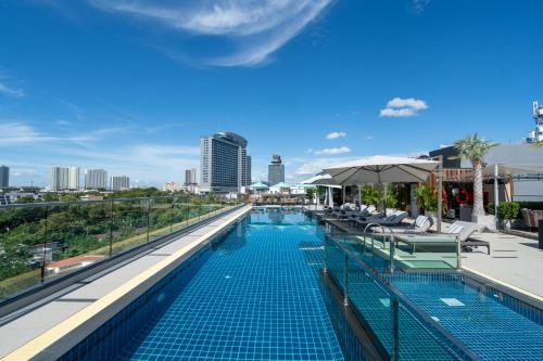 a swimming pool on the roof of a building at Courtyard by Marriott North Pattaya in Pattaya North