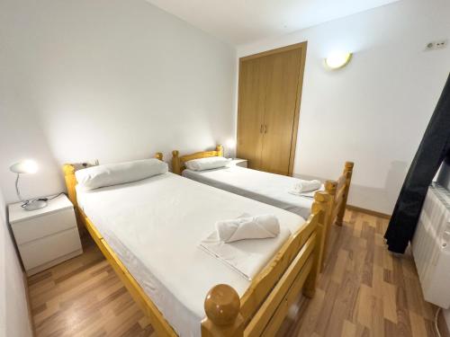 Postel nebo postele na pokoji v ubytování Apartamentos La Solana 3000
