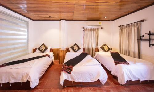 Postel nebo postele na pokoji v ubytování Nammavong Guesthouse