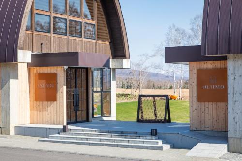 a building with a sign in front of it at Andaru Collection Niseko in Kutchan