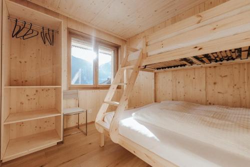 a bedroom with two bunk beds and a window at Haus W in Schruns