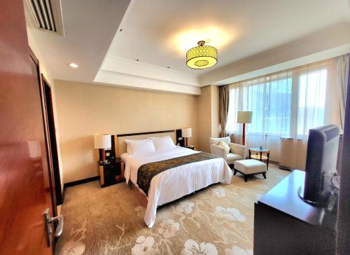 Postel nebo postele na pokoji v ubytování Tianjin Saixiang Hotel