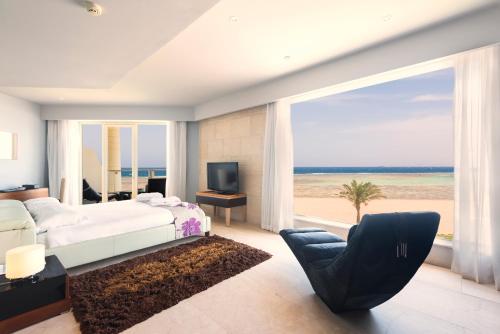 a bedroom with a bed and a view of the beach at Barceló Tiran Sharm in Sharm El Sheikh