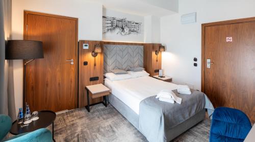 Postel nebo postele na pokoji v ubytování Focus Hotel Premium Kraków