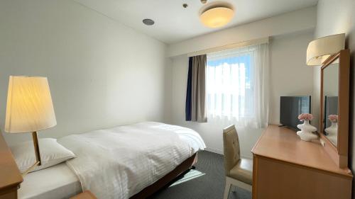 Katil atau katil-katil dalam bilik di Grand Park Hotel Panex Iwaki