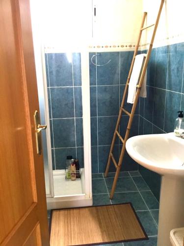a bathroom with a shower and a sink at 4 bed house, Private Pool near Beach in Burriana