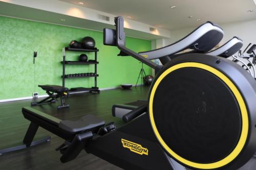 a room with a gym with a treadmill at Klima Hotel Milano Fiere in Milan