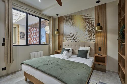 Giường trong phòng chung tại Appartement Coeur Montmartre by Studio prestige