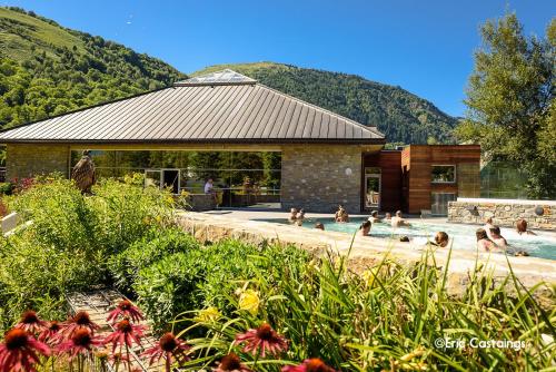 a group of people in a swimming pool at À 80m des pistes, bel appartement pour 15 in Génos