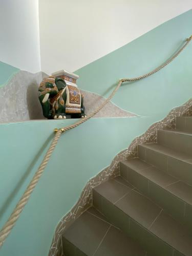 a toy on a rope next to some stairs at Pension Lizzi in Vienna