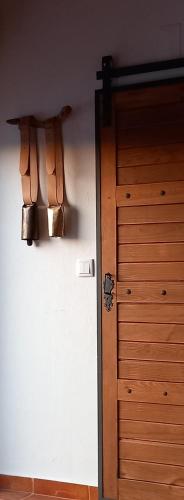 an open door to a room with a closet and a door at Casa das Rosas in Crato