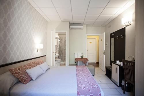 a bedroom with a large bed in a room at Domus Palatina in Rome