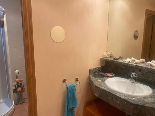 a bathroom with a sink and a mirror at RIERA BAIXOS in Tamariu