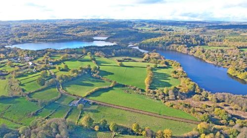 an aerial view of a field and a lake at A l'Orée du Lac, 500m lac de Chamboux in Saint-Martin-de-la-Mer