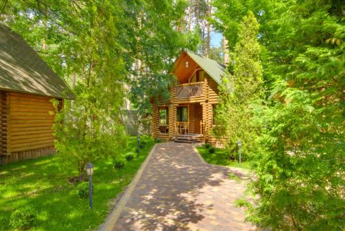 a log cabin with a walkway in front of it at Фортеця in Kyiv