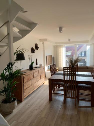 a hallway with a staircase in a building at Ozzy ‘s Place in Ostend