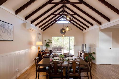 a dining room with a table and chairs at Maison Magnolia; Character Townhouse in the centre of Margaret River in Margaret River Town
