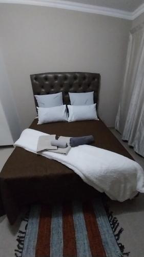 Ένα ή περισσότερα κρεβάτια σε δωμάτιο στο Rasesa Guest House