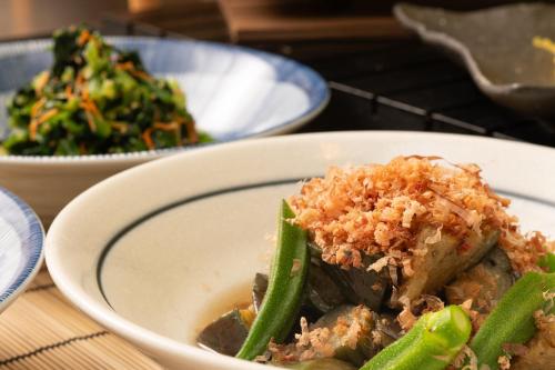 a plate of food with green beans and rice at Hotel the Lutheran in Osaka